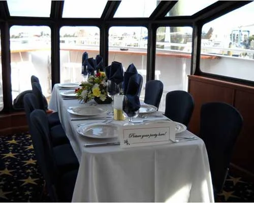 Dining tables set inside the yacht